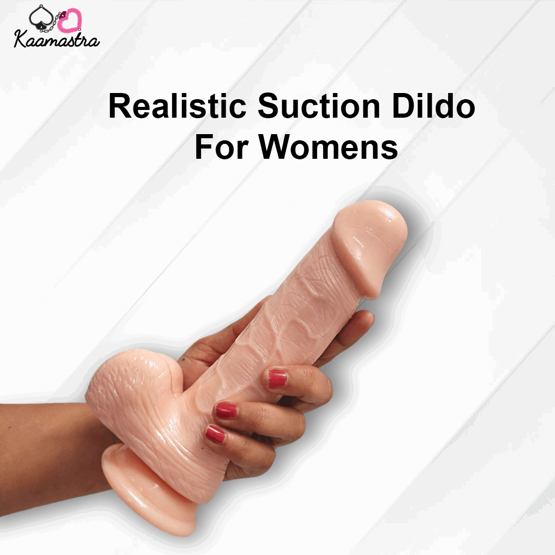 Realistic suction dildo for women held by a hand on a white background with 'Kaamastra' branding.