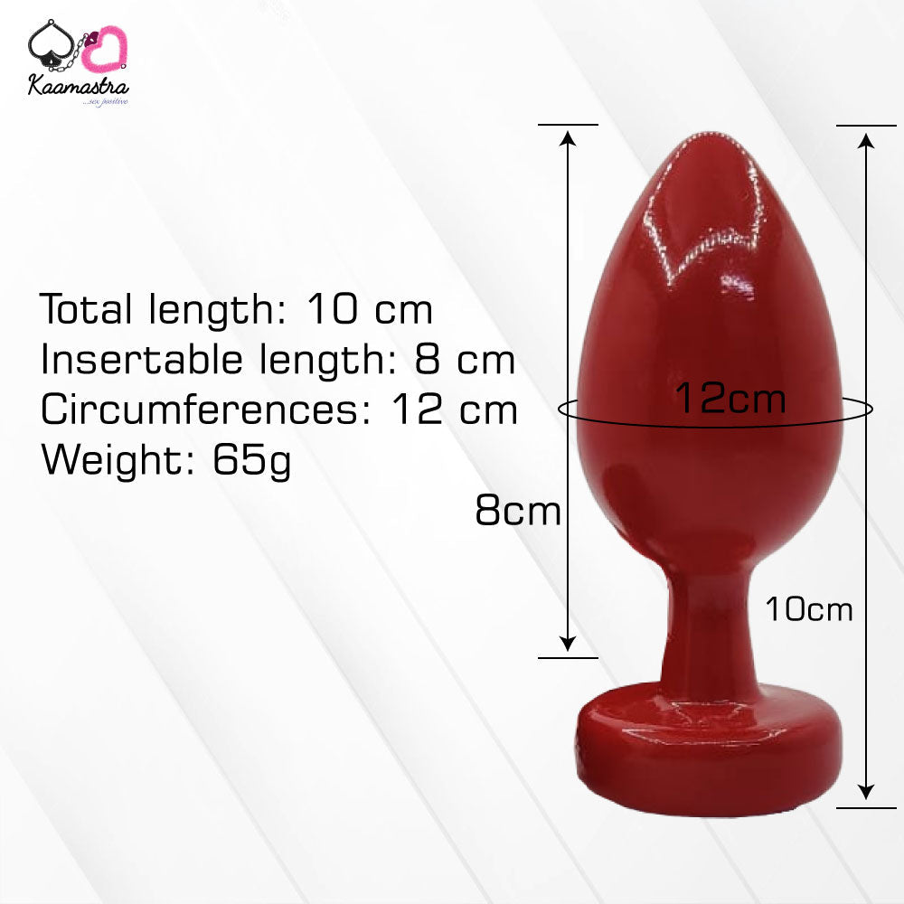 A collection of anal butt plugs in various colors, each featuring a crystal jewel at the base. The plugs are designed in a smooth, egg-shaped form.